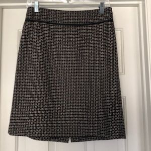 Black patterned wool skirt.